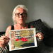 Christine holds a photo of the air ambulance that whisked her away