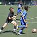 Two boys taking part in the centenary football