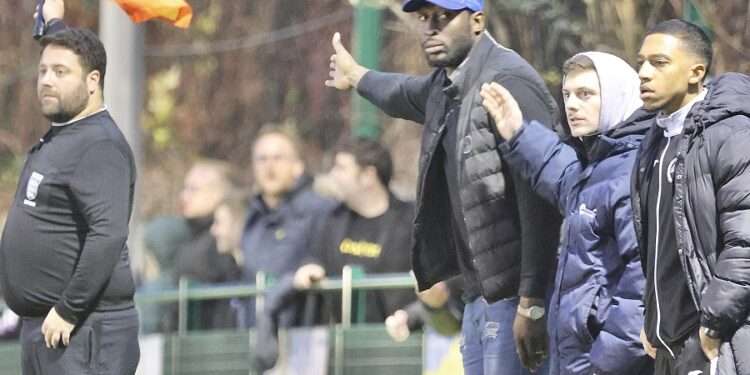 Fisher boss Ajay Ashanike (cap) directs from the sideline. Photo: Dave Anderson