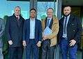 Vimal Pandya (centre) and MP Neil Coyle standing to his right outside the court