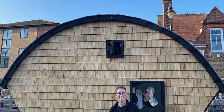 Harrison Marshall, 28, has built a house in a skip 'to get people talking' about the fact rents are so high.