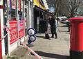 A police dog and its handler at the scene of a stabbing on Ilderton Road, Bermondsey.