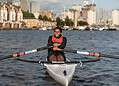 A girl rowing at Canada Water Dock