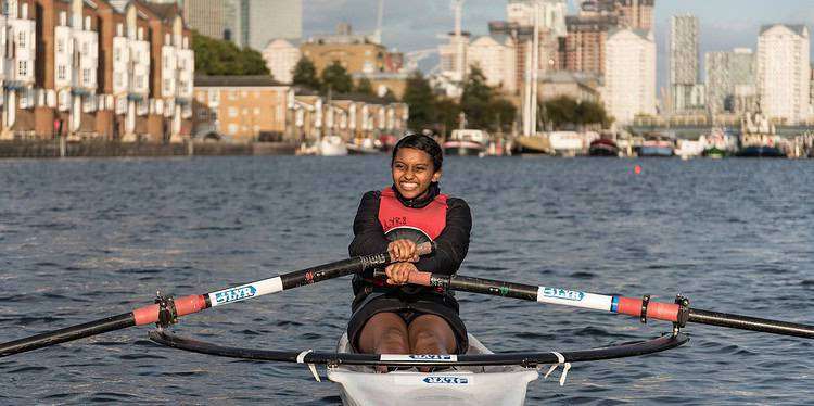 A girl rowing at Canada Water Dock