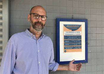 Charity Manager Luds Van Den Belt outside the closed Citizens Advice Bureau in Bermondsey