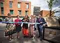 Jess Mills opens the Tessa Jowell Centre next to MP Helen Hayes to her left