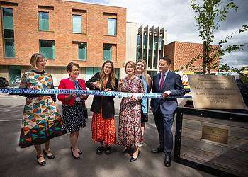 Jess Mills opens the Tessa Jowell Centre next to MP Helen Hayes to her left