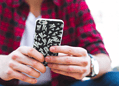 Stock image of teen texting on smartphone. Creator: Matthew Henry (Free Range Stock, Creative Commons)