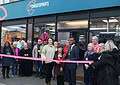 89-year-old Carolina cuts the ribbon at the East Dulwich store alongside Southwark Mayor Michael Situ