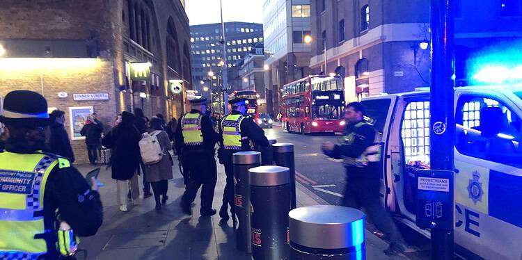 Officers surrounded the boy before putting him in the back of a police van