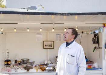 Russell Dryden with a regular seagull visitor to his stall in Bermondsey