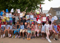 St Saviour's pupils hold posters reading: "We love our school"